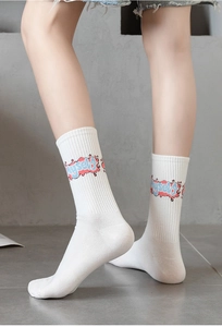 Close-up of white cotton athletic crew socks featuring blue and pink Myself lettering