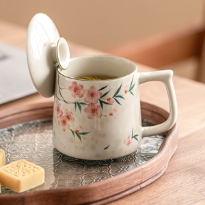 Chinese ceramic mug with hand-painted peach blossoms and lid for office tea use
