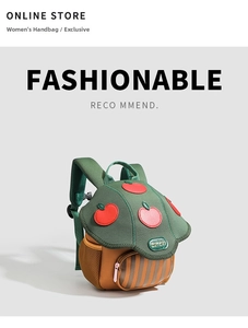 Detail view of cartoon mushroom kids backpack with embroidered apple and side mesh pocket