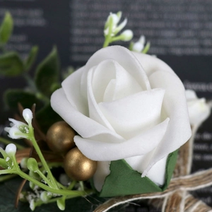 Elegant white foam rose wedding corsage with green leaves and jute twine wrapping