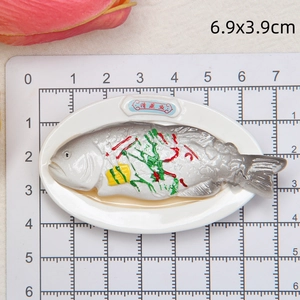 Close-up of steamed fish miniature resin fridge magnet with 6.9x3.9cm dimensions