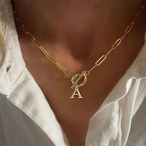 Gold paperclip chain necklace with toggle clasp and rhinestone letter A pendant