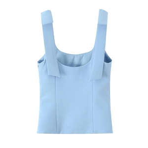 Detailed flat lay of light blue wide shoulder strap tank top with bow decoration