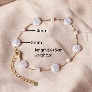 Detailed view of pearl bracelet on silk showing 4mm and 8mm sizes with 16+5cm length