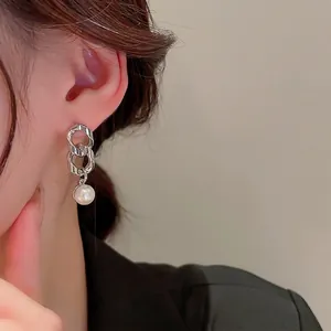 Asymmetric silver needle chain earrings with round portrait medal and white pearls