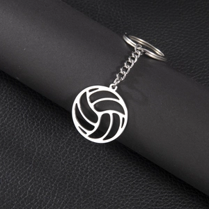 Sleek silver stainless steel volleyball pendant keychain on professional black pedestal