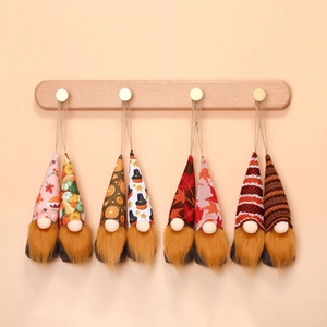 Detail of eight hanging autumn gnomes with fabric hats and long plush beards for decor