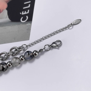Detail of stainless steel bead bracelet with lobster clasp and S.steel hallmark tag