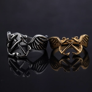 Punk style stainless steel nautical rings with anchor and wing designs in gold and silver