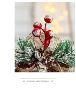 Detail of Christmas tree decoration with red berries, pine cones and rustic plaid bow