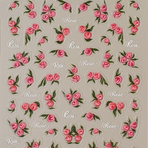 3D embossed pink rose nail stickers with green leaves and elegant script rose pattern