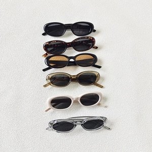 Set of six retro oval sunglasses in various colors including black, tortoiseshell and beige
