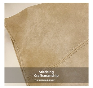 Detailed close-up showing precision double-stitching on a beige PU leather handbag