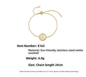 Detail view showing a 24cm adjustable stainless steel bracelet with white shell moon charm