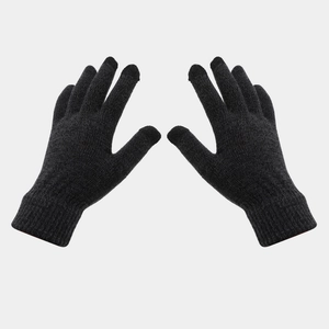Detail of black knitted gloves with tight weave and long ribbed windproof cuffs for winter