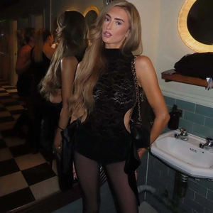 Close-up of black lace bodysuit featuring hollow-out sides and sheer mesh details