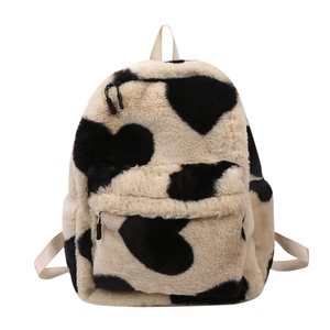 Cute off-white fuzzy backpack with black heart patterns and soft faux fur texture