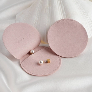 Pink suede microfiber envelope jewelry pouch in round folding design for accessories