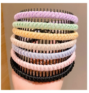 Detail showing seven colorful non-slip fabric headbands with plastic teeth for girls