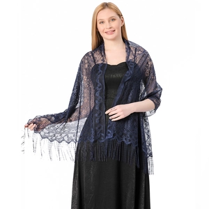 Detail of navy blue lace shawl showing floral hollow weave and long fringe trim