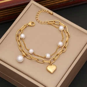 Double-layered golden stainless steel necklace with white pearls and heart pendant