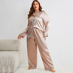 Elegant champagne silk satin pajama set with long sleeves and black piping trim