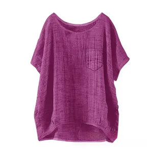 Detail of loose purple linen blouse with chest pocket and asymmetrical curved hemline