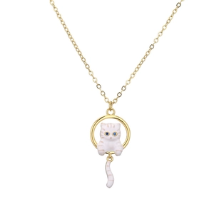 Gold pendant necklace featuring a white enamel cat with blue eyes inside a circular frame