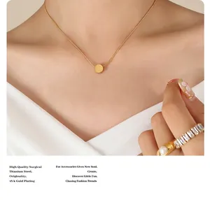Detail of 18k gold plated titanium steel necklace with a sliding double-sided Fu pendant