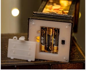 Close-up of bottom battery compartment and switch on vintage Santa Christmas lantern