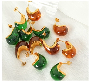 Detail view of retro emerald and amber resin teardrop earrings with 18K gold plated trim