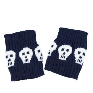 Detailed knit of dark blue boot cuffs with white skull pattern on white background