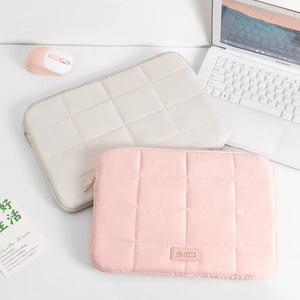 Detail view of quilted shockproof laptop sleeve for 14-inch notebooks with top zipper