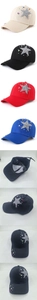 Detailed view of silver glitter stars and colorful rhinestones on a cotton baseball cap