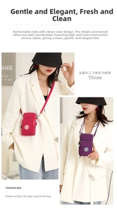 Detailed view of magenta and purple nylon phone crossbody bags with silver metal zippers