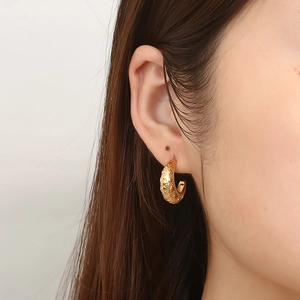 French vintage 18K gold-plated hoop earrings with engraved heart patterns on model