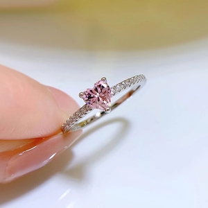 Close-up of S925 silver ring featuring a pink heart-shaped stone and side diamonds