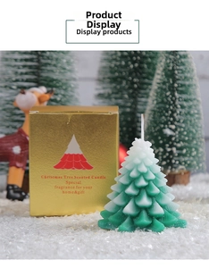Detailed Christmas tree candle with green gradient texture and elegant gold gift box display