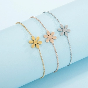 Minimalist stainless steel daisy flower bracelet in gold, rose gold, and silver finishes