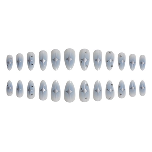 Blue ombre almond press-on nails with silver star patterns and rhinestone accents