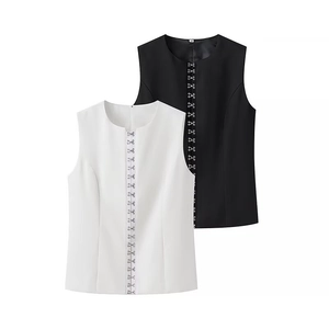 Women's chic sleeveless button-up top and pants set in classic black and white