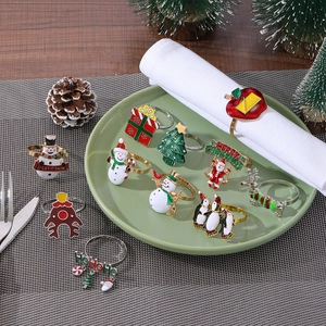 Set of 12 festive metal Christmas napkin rings featuring snowman and Santa designs