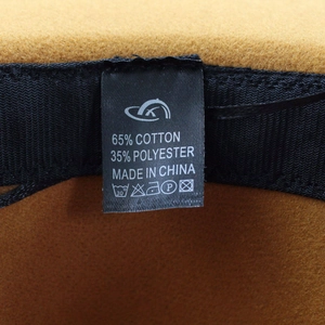 Detail view of cotton polyester wool hat interior with care label and inner band
