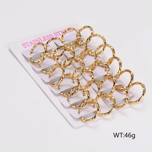 Detailed set of 12 pairs of golden twisted stainless steel hoop earrings on card