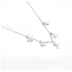 Detailed view of stainless steel necklace showing moon pendant and white rhinestone charms