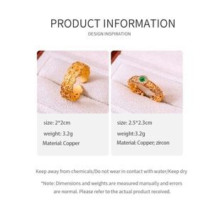 Detailed view of 24k gold-plated rings with copper base and green zircon stone specs
