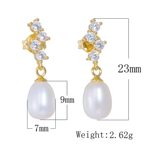 Macro detail of drop pearl earrings with dimensions showing 23mm length and 9mm height