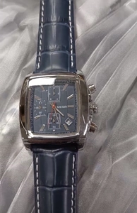 Detailed close-up of MEGIR blue square face watch with silver case and leather strap