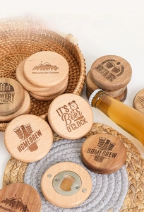 Macro detail of round beech wood bottle openers with vintage engraved patterns on a tray