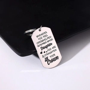 Polished stainless steel dog tag keychain with engraved quote and heart crown icons